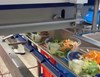 Dosificador topping sobre ensalada